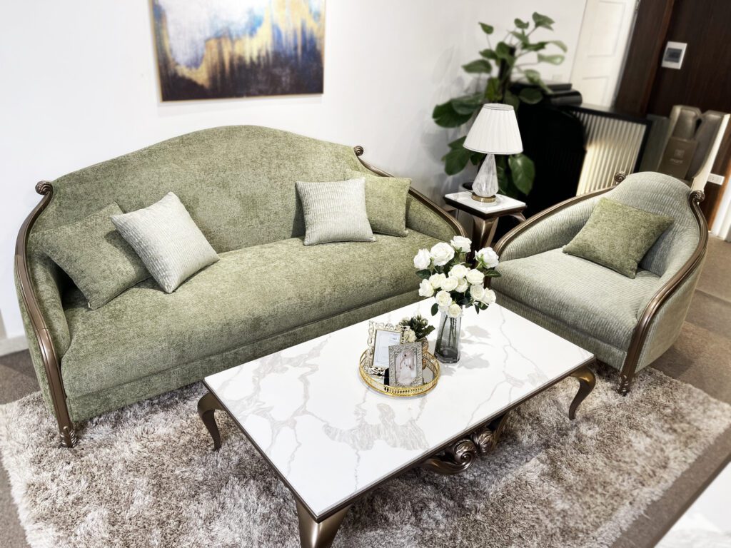 Sofa Le Melange tân cổ điển bọc vải xanh rêu, khung sơn nâu kim